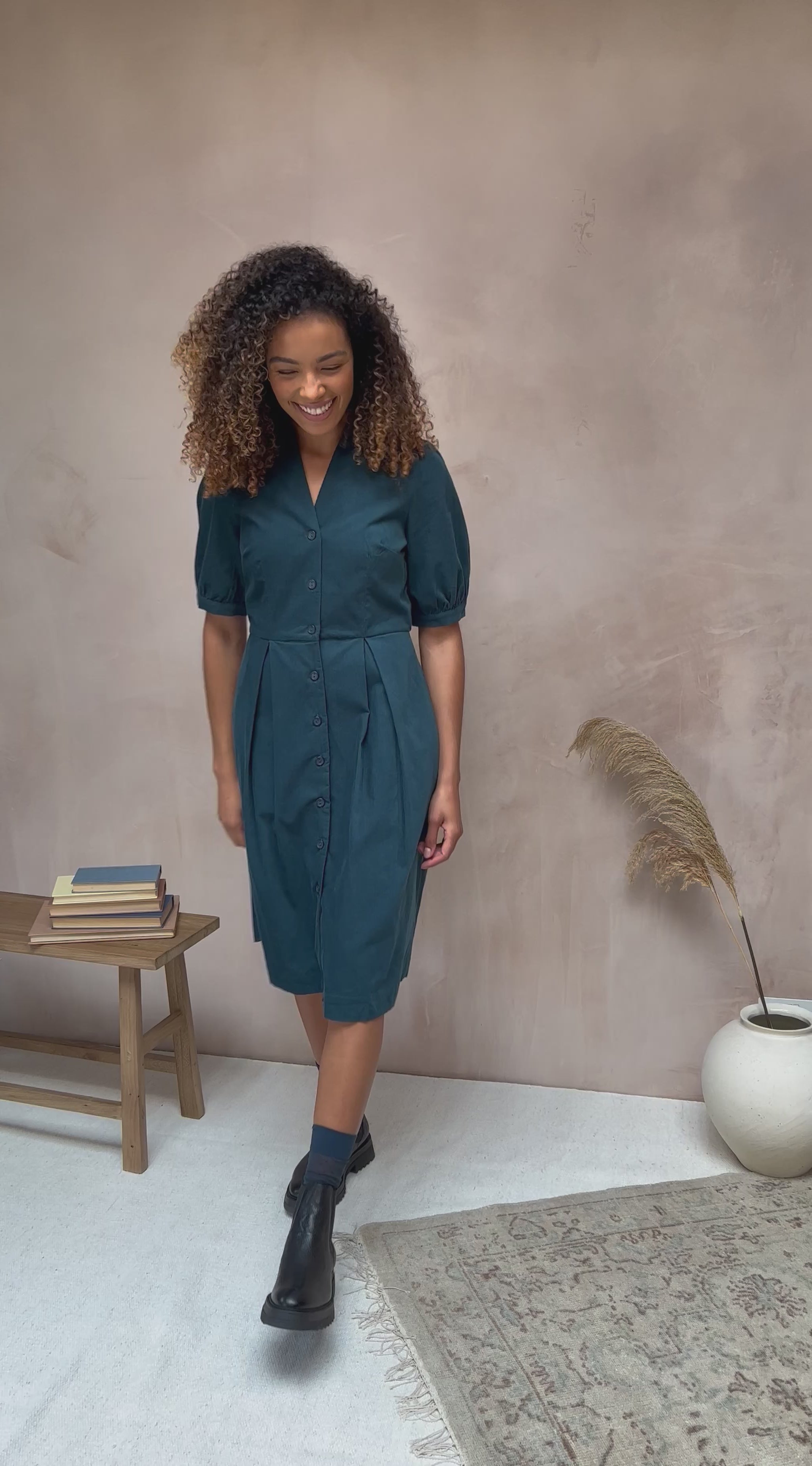 Image of the Stella Shirt Dress in Deep Teal Needlecord by Emily and Fin, featured in a video.