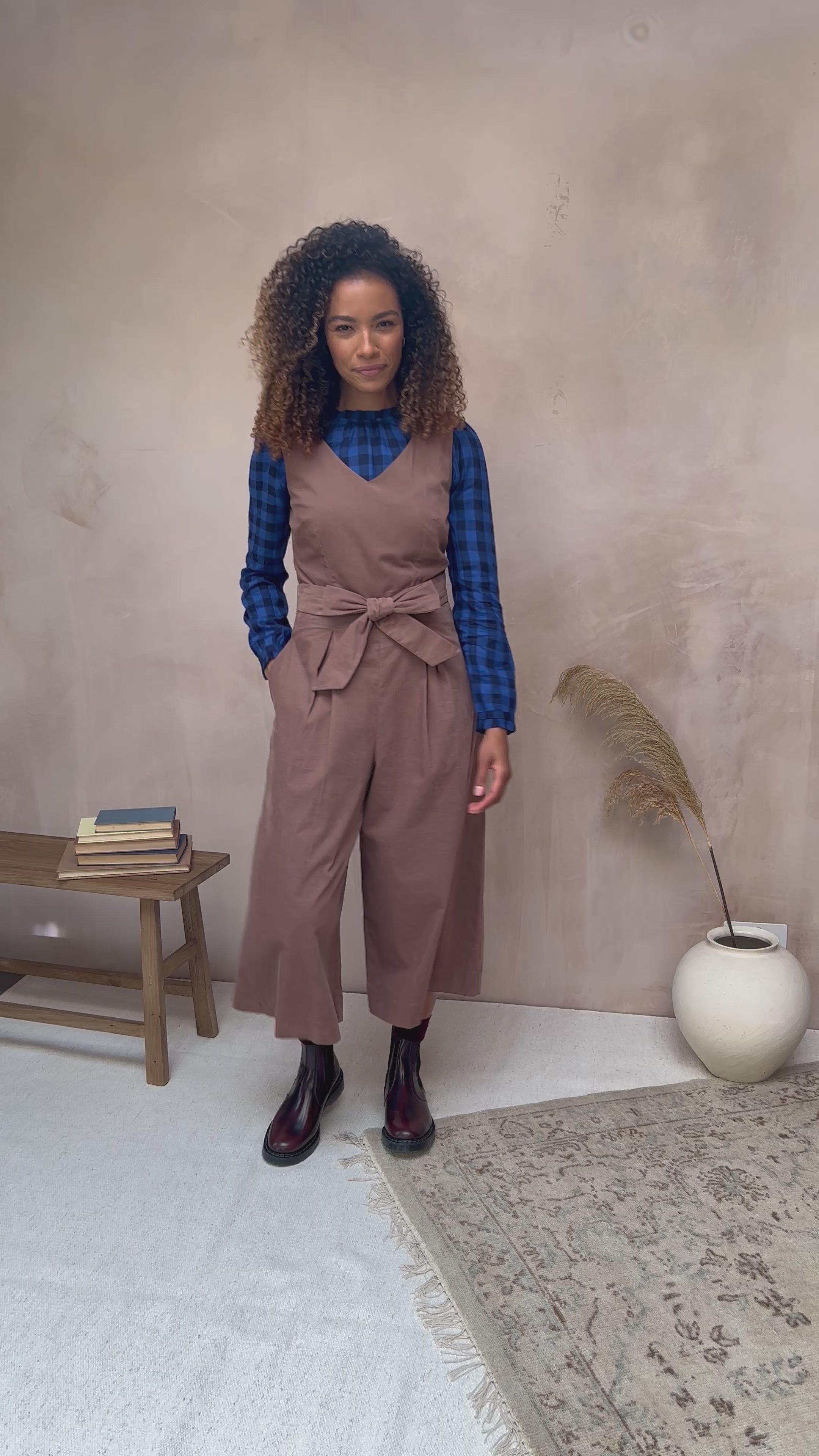 Video showcasing the Margot Jumpsuit in Hazelnut Needlecord by Emily and Fin. The jumpsuit radiates charm with its hazelnut hue and cozy needlecord fabric, as seen in the captivating video.